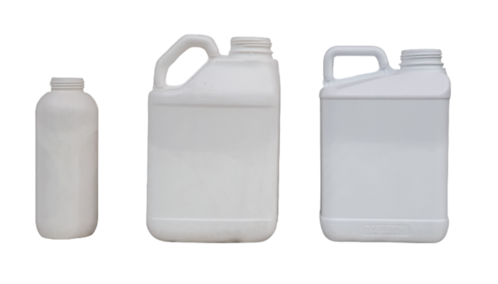 Three empty plastic containers of various sizes used with industrial filling equipment for large containers.