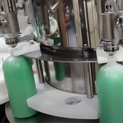 Monoblock filling and capping system processing tire sealant bottles at high speed.