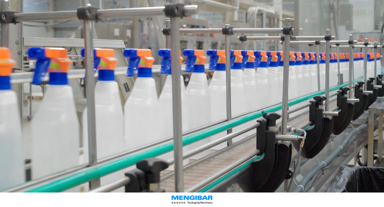 Automated capping machine for trigger sprayers on a production line