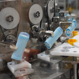 Hot fill line for deodorants handling multi-format containers at high speed (300 UPM)